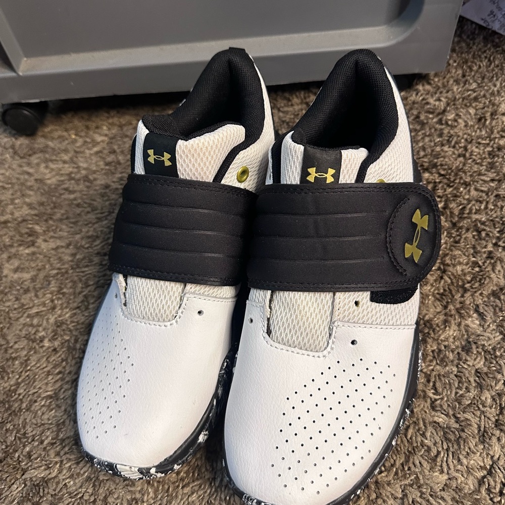 Under Armour Kids' White and Black Sneakers with Gold Accents